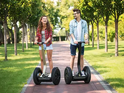 Girl and man on Segways